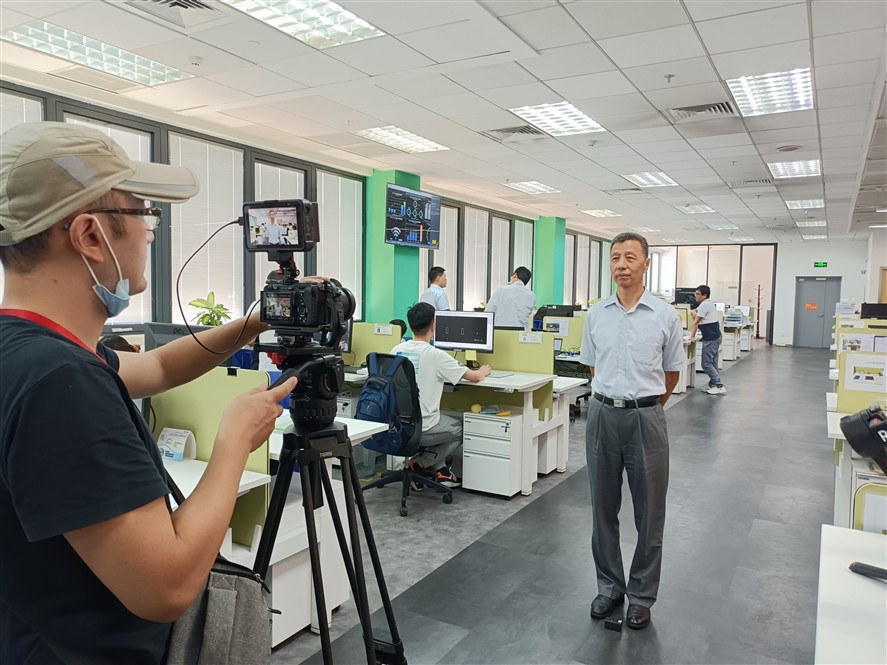 Interview filming in a Shenzhen office environment